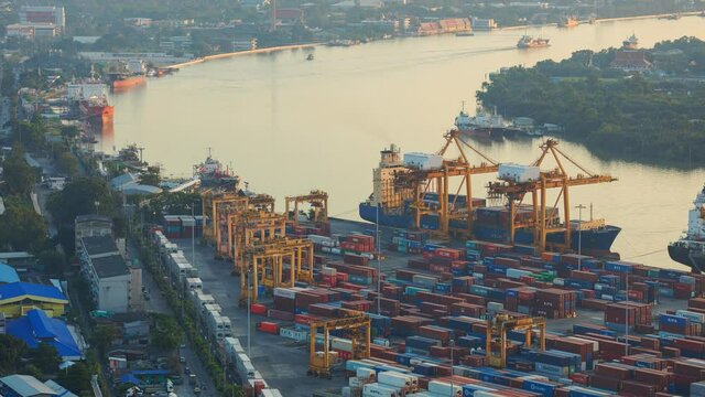 Bangkok,Thailand - November 20,2021 Container ship loading and unloading in Bangkok Port, Aerial view of business logistic import and export freight transportation by container ship, Container loading
