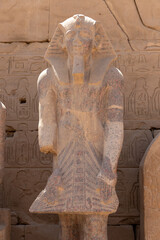 Statue of pharaoh at the temple of Karnak in Luxor, old Egypt.