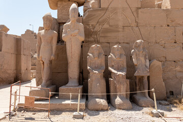 Statues of pharaohs at the temple of Karnak in Luxor, old Egypt.