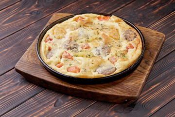 Gratin potato with golden filling on baking dish