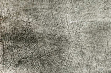  Stare szare tło powierzchni ściany po spoinowaniu kleju szpachlowego z teksturą pęknięć.