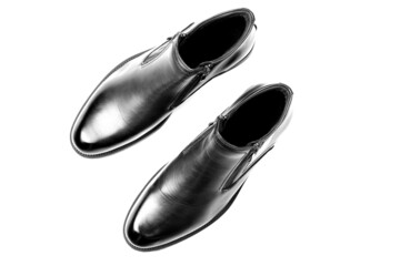 New black shoes for men with zippers isolated on a white background. Men's comfortable shoes. Top view, flat lay.