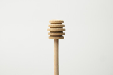 Close up of honey dipper isolated with white background. Honey dipper top view
