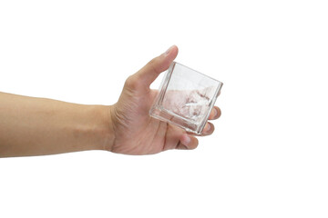Close up of hand holding whiskey glass isolated with white background. Asian man's hand.