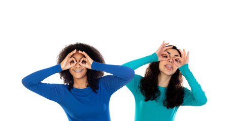 Fototapeta na wymiar Two cheerful girls looking through her hands like a glasses