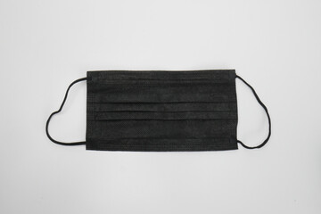 Close up of black surgical mask isolated with white background