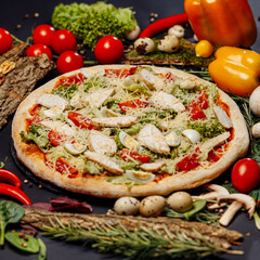 Top view pizza on table top, Flat lay of pizza on black background, Prepared pizza on table for serve Freshly baked homemade pizza isolated on a black background with vegetables. View from above