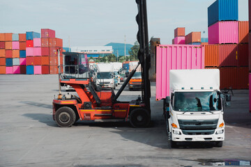 Work in the container yard and the car is lifting. Cargo container in the cargo yard