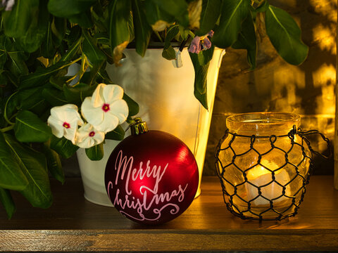 Christmas vintage flowers and decoration with illuminated glass lantern