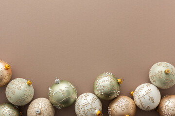 Obraz premium Christmas balls on powdery background, Merry Christmas and Happy New Year concept, top view, copy space