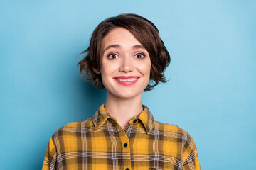 Fototapeta premium Photo of cheerful positive girl toothy beaming smile wear checkered shirt isolated blue color background