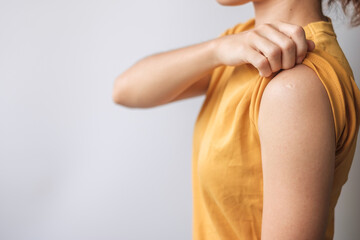 woman showing blank arm and not receiving covid 19 vaccine. Vaccination, herd immunity, side effect, anti vaccine and Coronavirus pandemic
