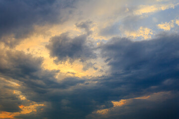 Heavy rainstorm in colorful stormy sky at evening 
