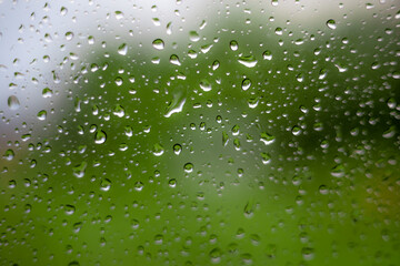 Rain drops on window glass outside texture background water