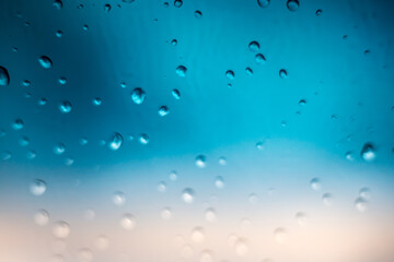 Rain drops on window glass outside texture background water