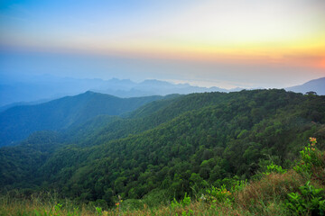 Fototapeta premium World environment day concept: Green mountains and beautiful blue sky clouds 