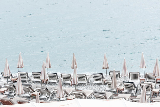 beach chairs and umbrellas at promenade des anglais