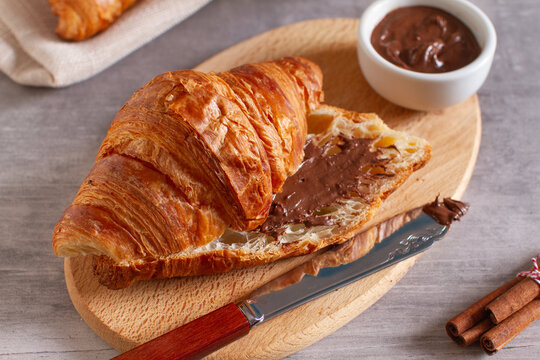 Croissant with chocolate and cappuccino