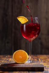 glass of red wine with lemon