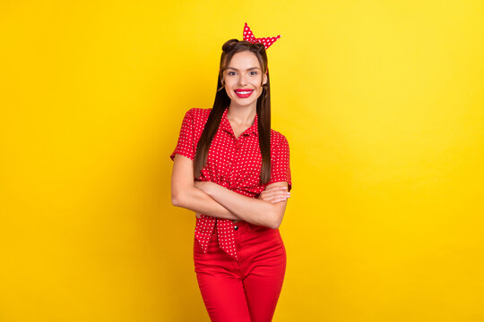 Photo of adorable sweet young woman dressed red clothes smiling arms crossed isolated yellow color background