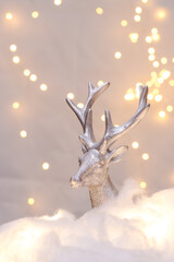 Christmas decoration silver deer with bookeh background