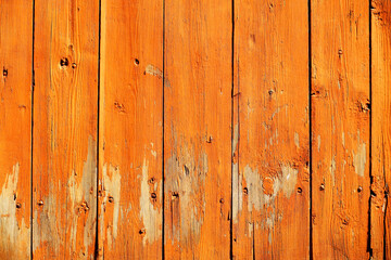 Wooden ocher background. Old barn wall with peeling paint