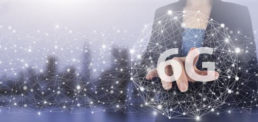 Abstract world network connection, internet and global connection concept. Hand touch digital screen hologram 6G sign on city light blurred background. 6G Network Internet Mobile Wireless Business.