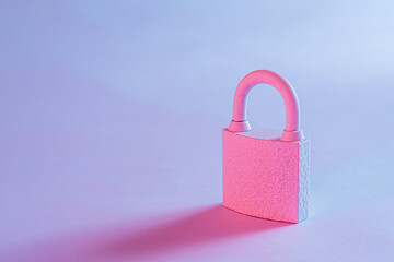 Close-up of a lockpad with shadow on studio blue background