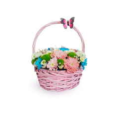 Fototapeta na wymiar Basket with bright flowers on a white background. Isolate of a bouquet of flowers, chrysanthemums and daisies in a pink wicker basket.