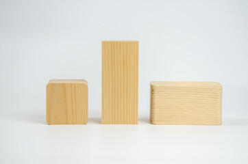 Wooden cubes from different tree species with different edge treatments. several wooden building blocks on a white background. Eco-friendly materials for construction, decoration and repair.