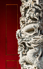 Chinese dragon statue on red background