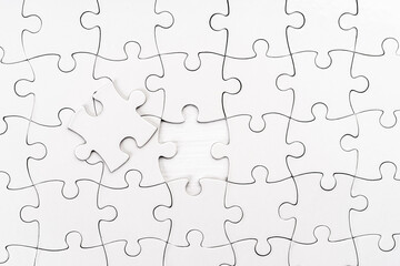 Top view of white jigsaw puzzle