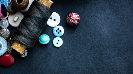 Sewing supplies macro with copy space on dark background
