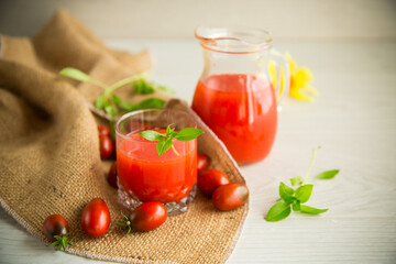 homemade freshly squeezed tomato juice with pulp in a glass decanter