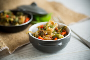 fried brussels sprouts with cauliflower and other vegetables in a bowl
