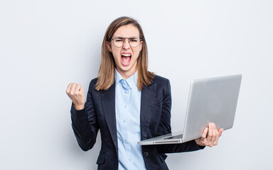 businesswoman young pretty woman shouting aggressively with an angry expression. business and...