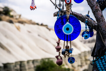 Close up view of evil eye amulet on mountain background in Cappadocia, Turkey