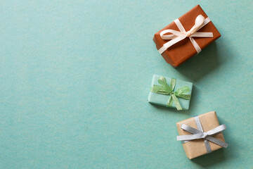 Gift boxes on green background. top view, copy space