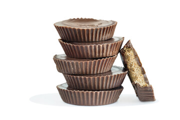 Chocolate peanut butter cup candy isolated over a white background with light shadow. Clipping path included.