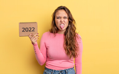 hispanic pretty woman feeling disgusted and irritated and tongue out. calendar concept