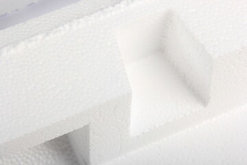 Styrofoam Sheets of different shapes on white background. Pieces of white styrofoam close up. Crumbled styrofoam pieces isolated on white background 