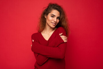 Photo of beautiful positive smiling adult woman wearing stylish clothes standing isolated on colorful background with copy space looking at camera