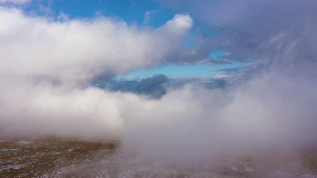 Flying through Clouds in Mount Evans Area. Aerial View. Colorado, USA. Drone Flies Forward