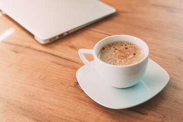 Drink your cup of coffee before you start working on laptop computer