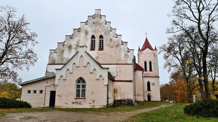 Fototapeta na wymiar Very old Lutheran church in the Latvian village of Aizpute in late autumn 2021