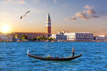 Gondola in the lagoon and the main view of Venice, Italy