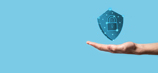 Businessman hold low poly polygon shield with a padlock icon.Secure Access System Concept.Business...
