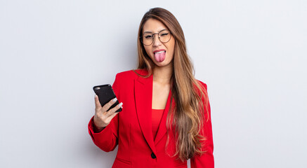 asiatic pretty woman with cheerful and rebellious attitude, joking and sticking tongue out....