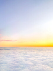 Clouds and sky background, bird's eye view at sunset, dawn, beautiful atmospheric pastel background
