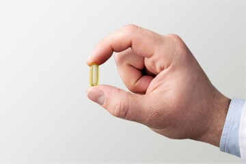 Male doctor with holding medicine pill. Medical covid-19 concept.